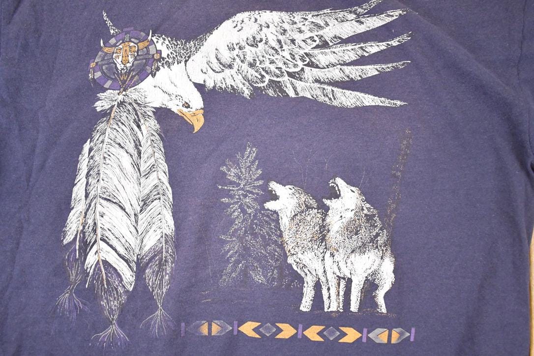 Vintage 1990s Outdoorsman Howling Wolves Eagle Souvenir T-Shirt Men's XL from propervintagecanada