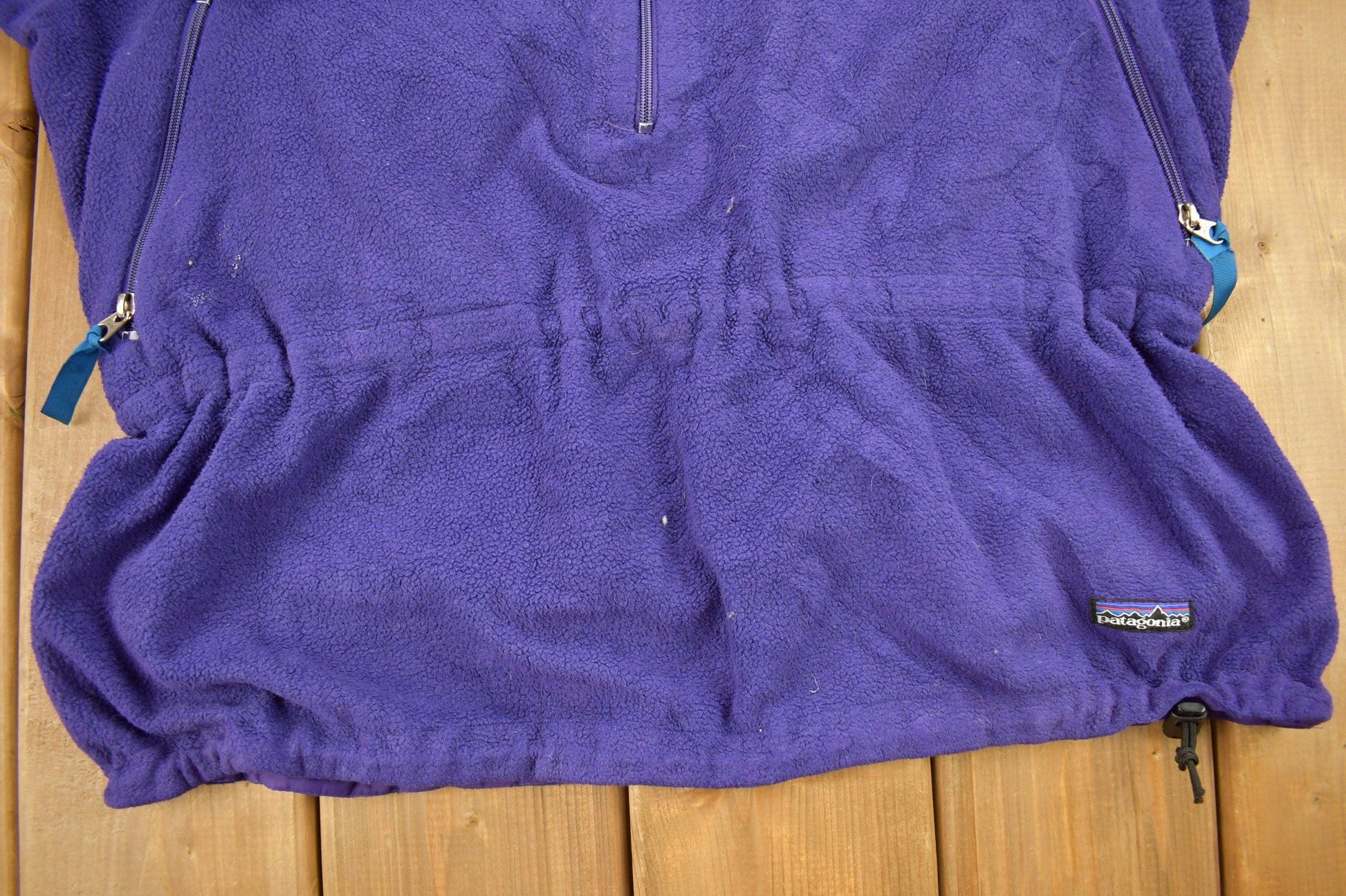 Vintage 1990s Patagonia Purple Half Zip Cinched Sweatshirt Men's Large from propervintagecanada