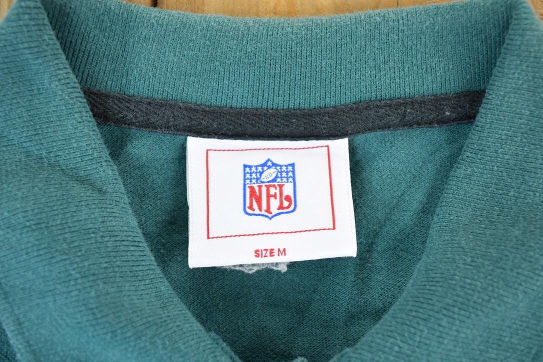Vintage 1990s Philadelphia Eagles NFL Graphic Polo Style T-Shirt Made In USA Men's Medium from propervintagecanada