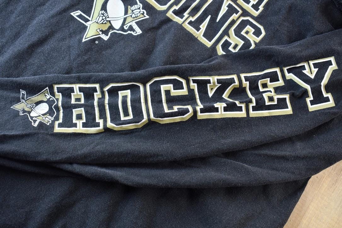 Vintage 1990s Pittsburgh Penguins NHL Hockey Long Sleeve Graphic T-Shirt Men's Large from propervintagecanada