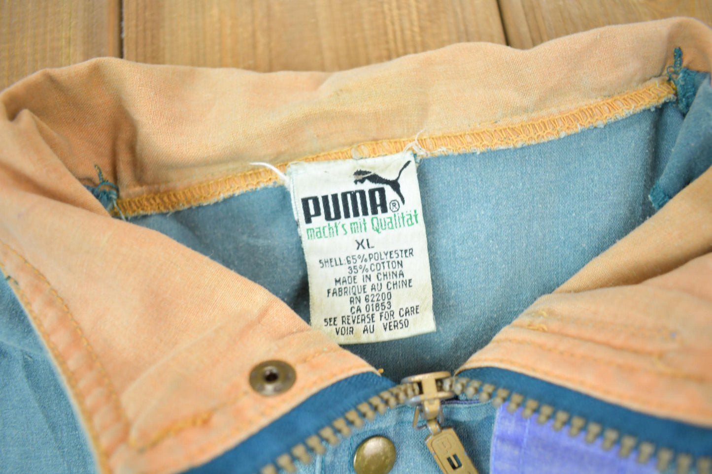 Vintage 1990s Puma Embroidered Sun Faded Windbreaker Jacket Size XL Men's XL from propervintagecanada