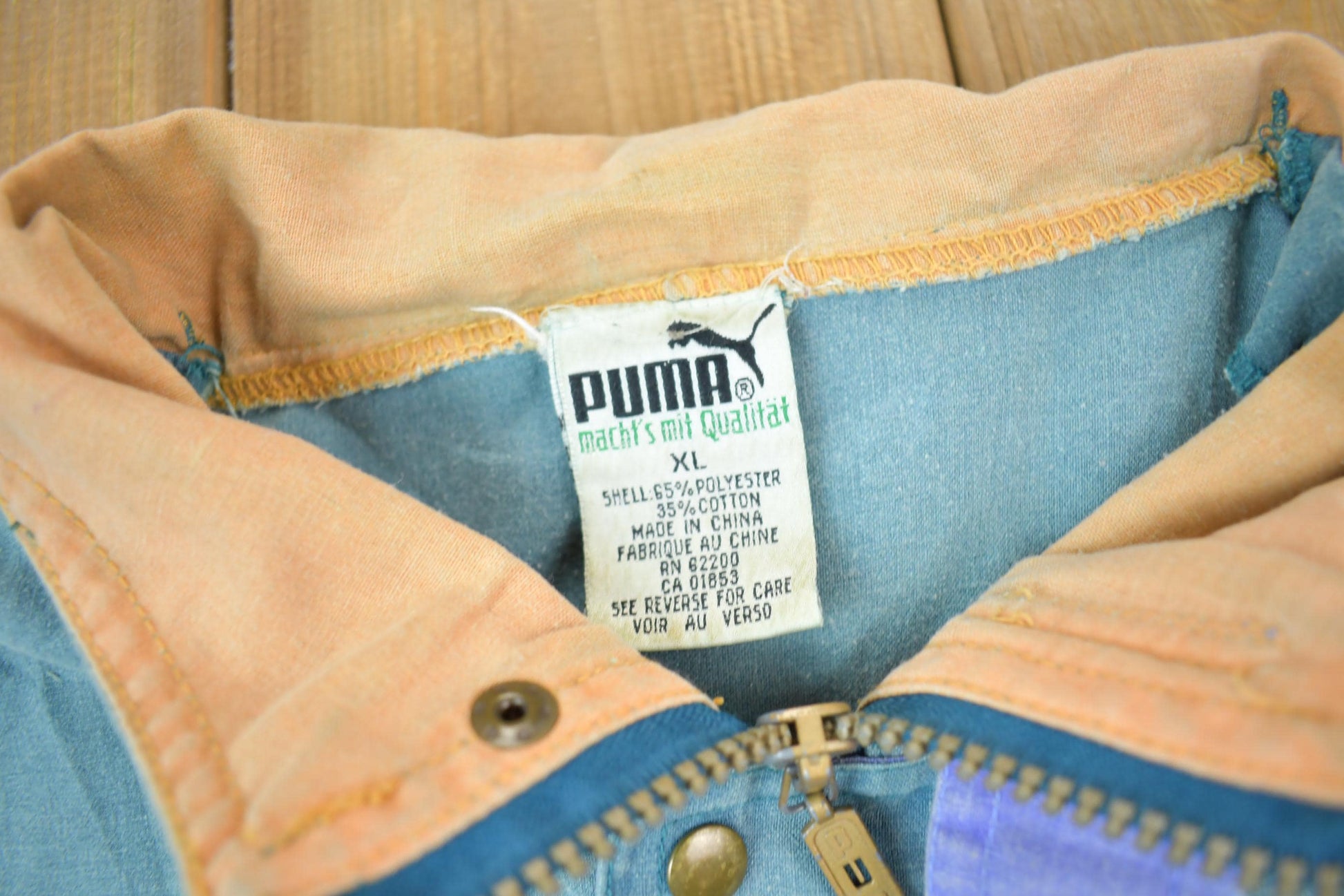 Vintage 1990s Puma Embroidered Sun Faded Windbreaker Jacket Size XL Men's XL from propervintagecanada