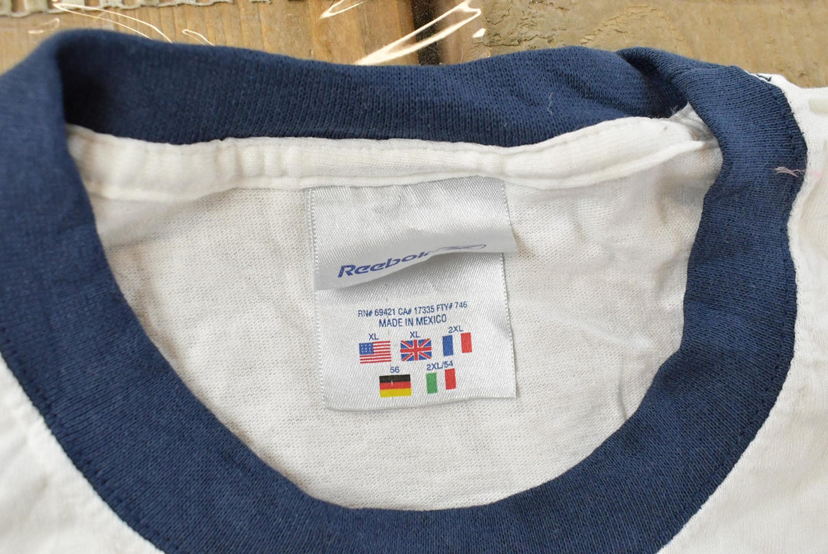 Vintage 1990s Reebok Logo Ringer Graphic T Shirt Mens XL from propervintagecanada
