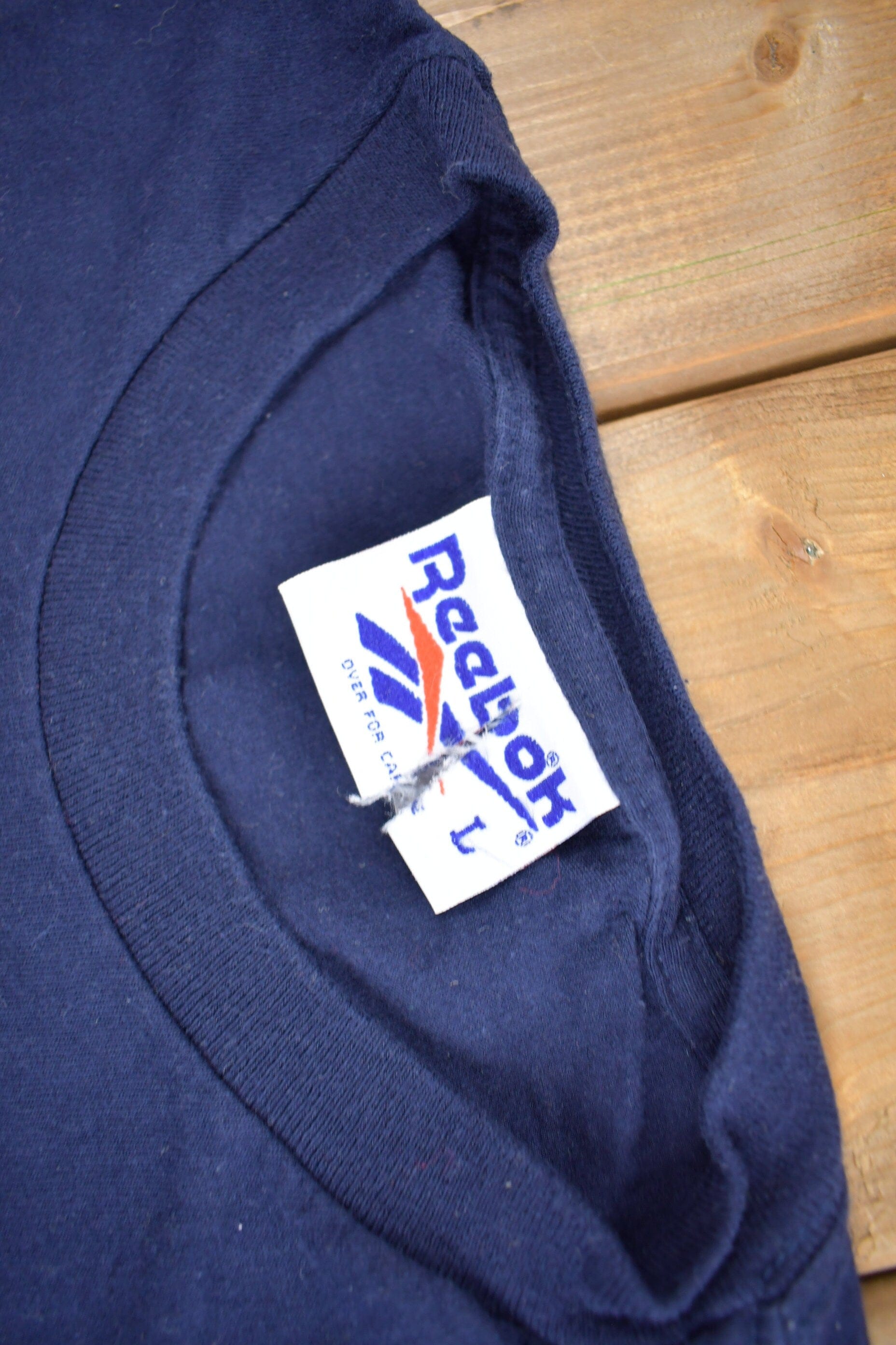 Vintage 1990s Reebok Long Sleeve Graphic T Shirt Men's Medium from propervintagecanada