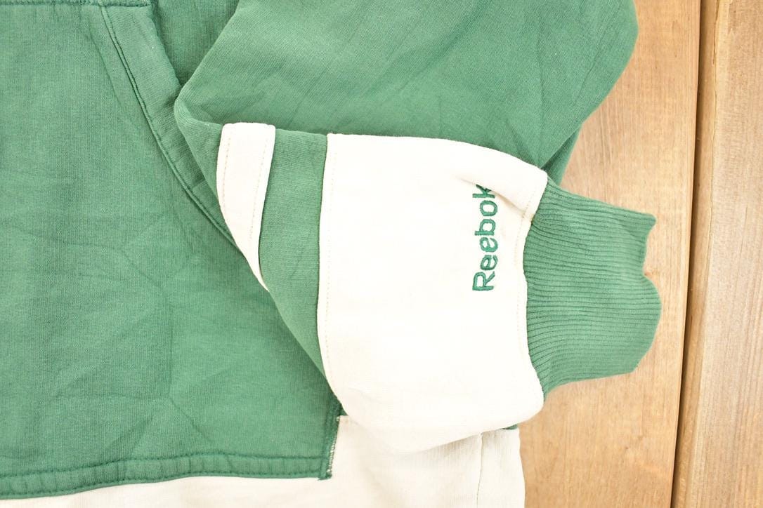 Vintage 1990s Reebok Minnesota Wild NHL Hockey Hoodie Sweatshirt Mens L from propervintagecanada