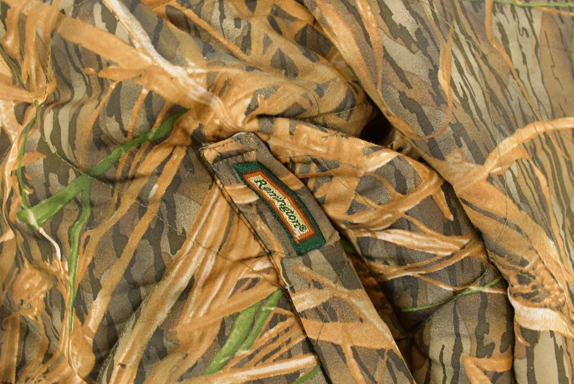 Vintage 1990s Remington Tree Camo Reversible Jacket Men's 2XL from propervintagecanada