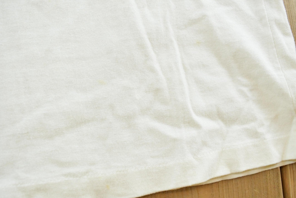Vintage 1990s Roots Athletics Graphic T-Shirt Men's M from propervintagecanada