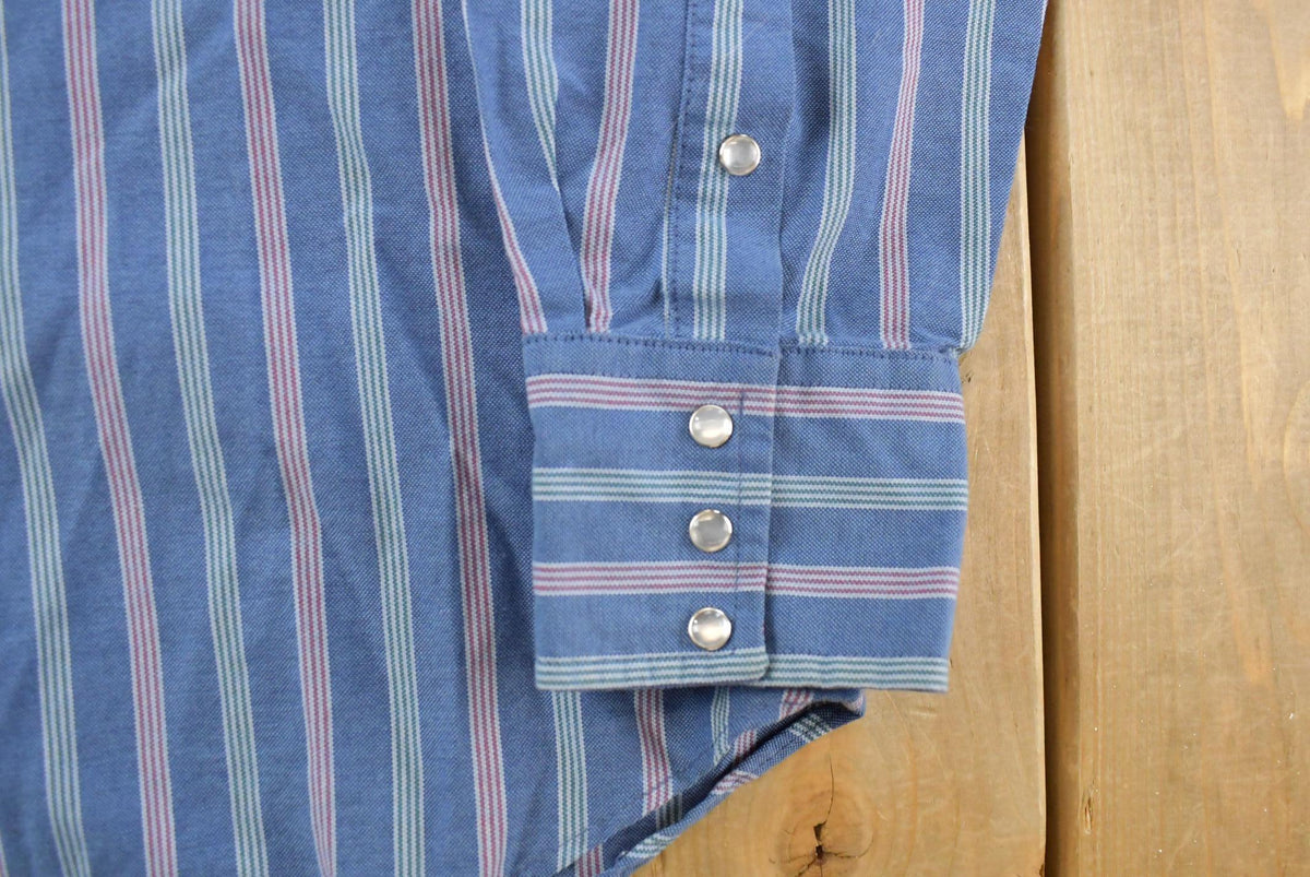Vintage 1990s Ruddock Western Plaid Flannel Pearl Snap Shirt Men's L from propervintagecanada