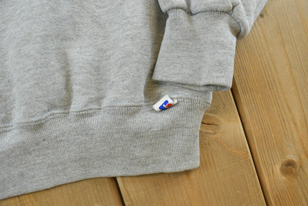 Vintage 1990s Russell Athletic Connecticut Huskies University Embroidered Crewneck Men's M from propervintagecanada