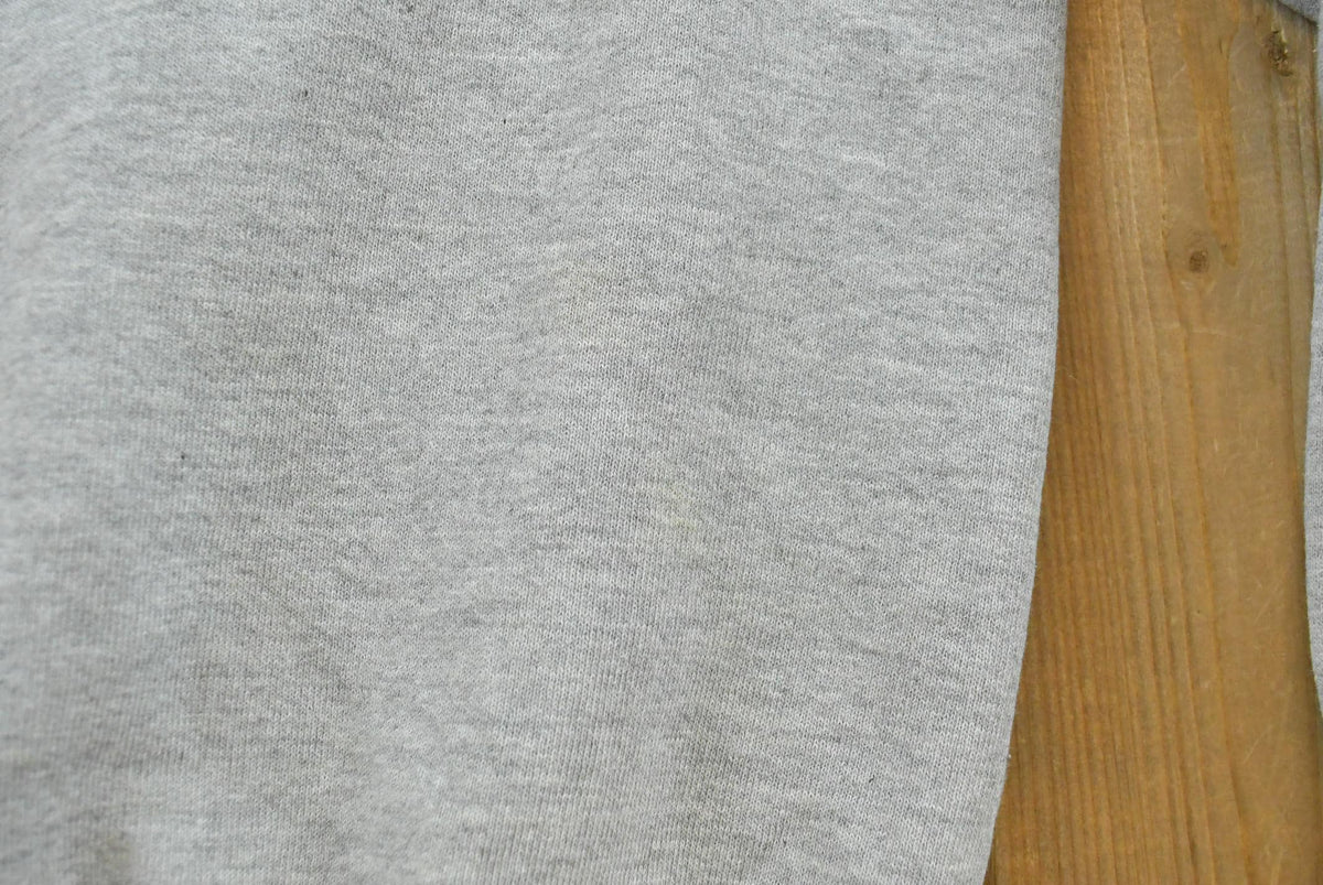 Vintage 1990s Russell Athletic Connecticut Huskies University Embroidered Crewneck Men's M from propervintagecanada