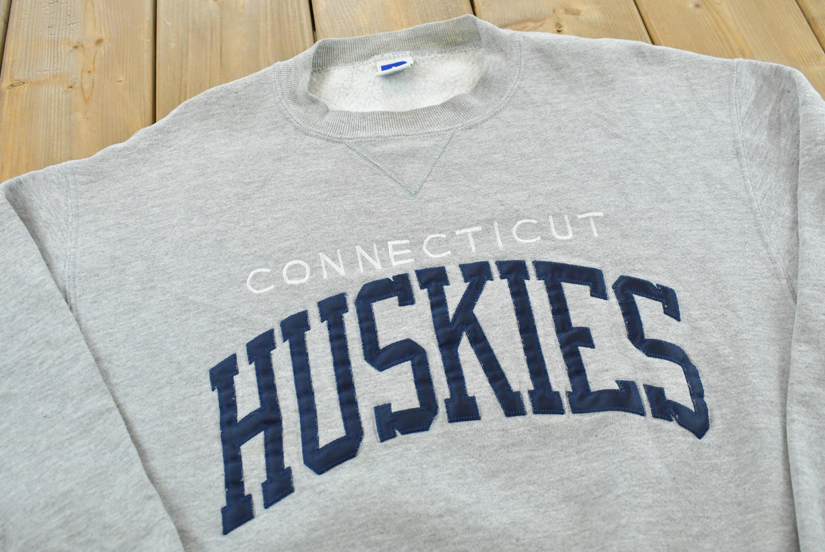 Vintage 1990s Russell Athletic Connecticut Huskies University Embroidered Crewneck Men's M from propervintagecanada