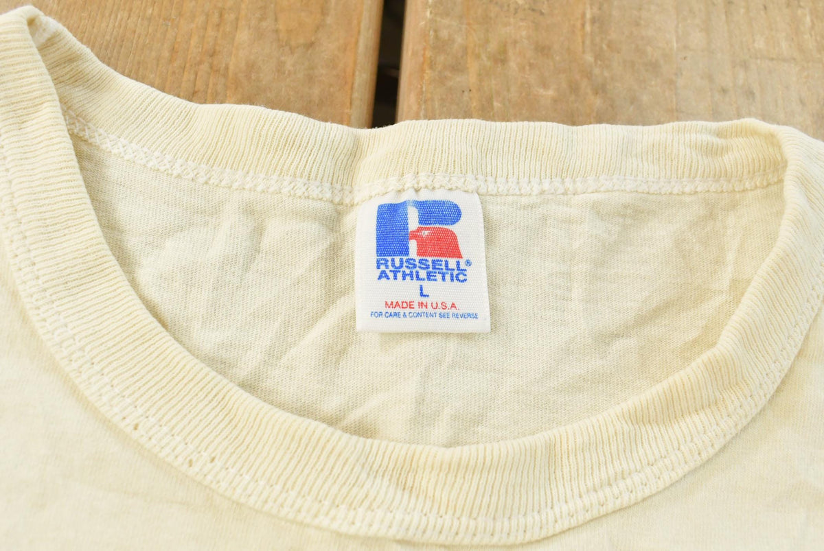 Vintage 1990s Russell Athletic NCAA Basketball University of Kansas Jayhawks Collegiate T-Shirt Men's L from propervintagecanada