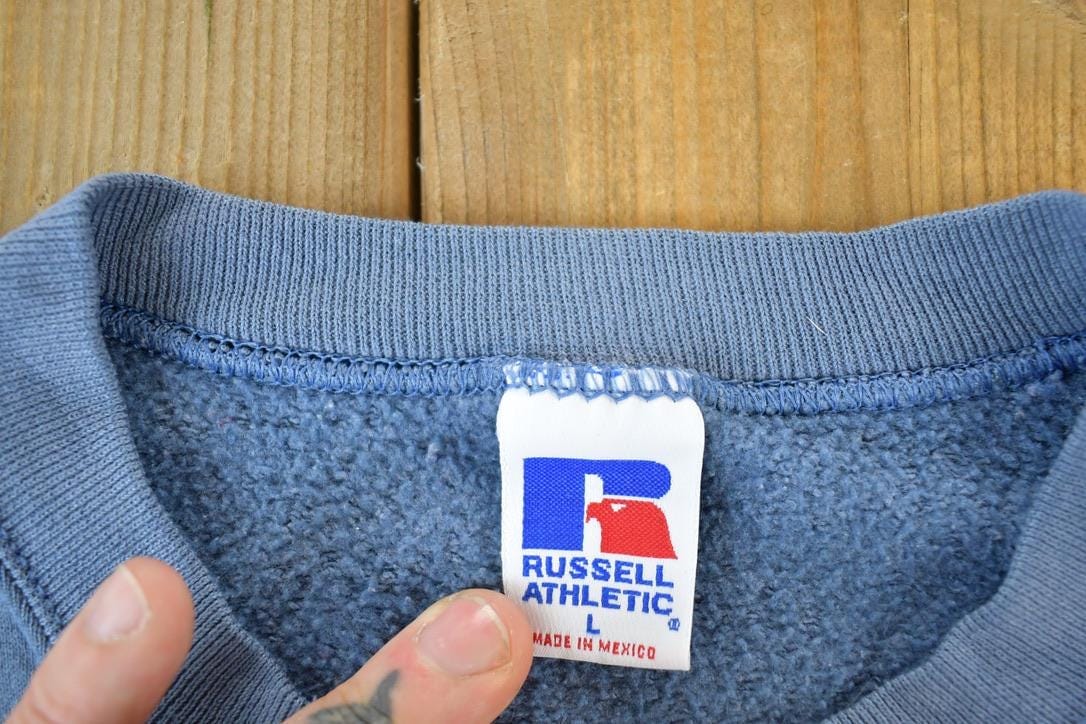 Vintage 1990s Russell Athletic Souvenir Crewneck Sweatshirt Made In USA Men's Large from propervintagecanada