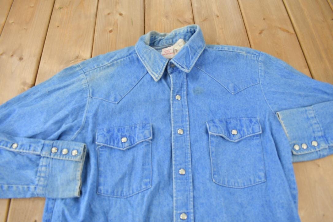 Vintage 1990s Saddle King Western Denim South Western Style Pearl Snap Button Up Rodeo Shirt Men's XL from propervintagecanada