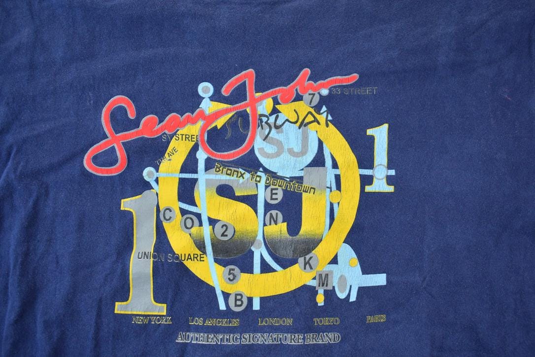 Vintage 1990s Sean John Souvenir Single Stitch Hip Hop Graphic Print T-Shirt Men's XL from propervintagecanada