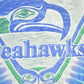 Vintage 1990s Seattle Seahawks Liquid Blue NFL Logo Graphic T-Shirt Men's XL from propervintagecanada