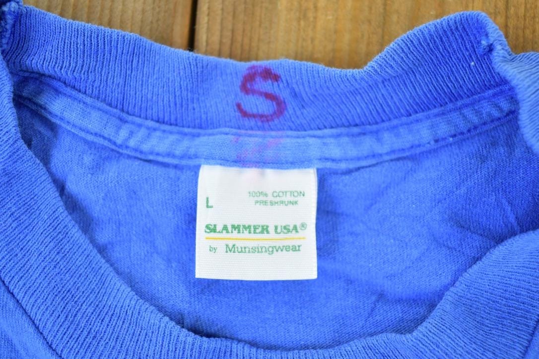 Vintage 1990s Slammer USA Souvenir Single Stitch Graphic Print T-Shirt Men's Large from propervintagecanada