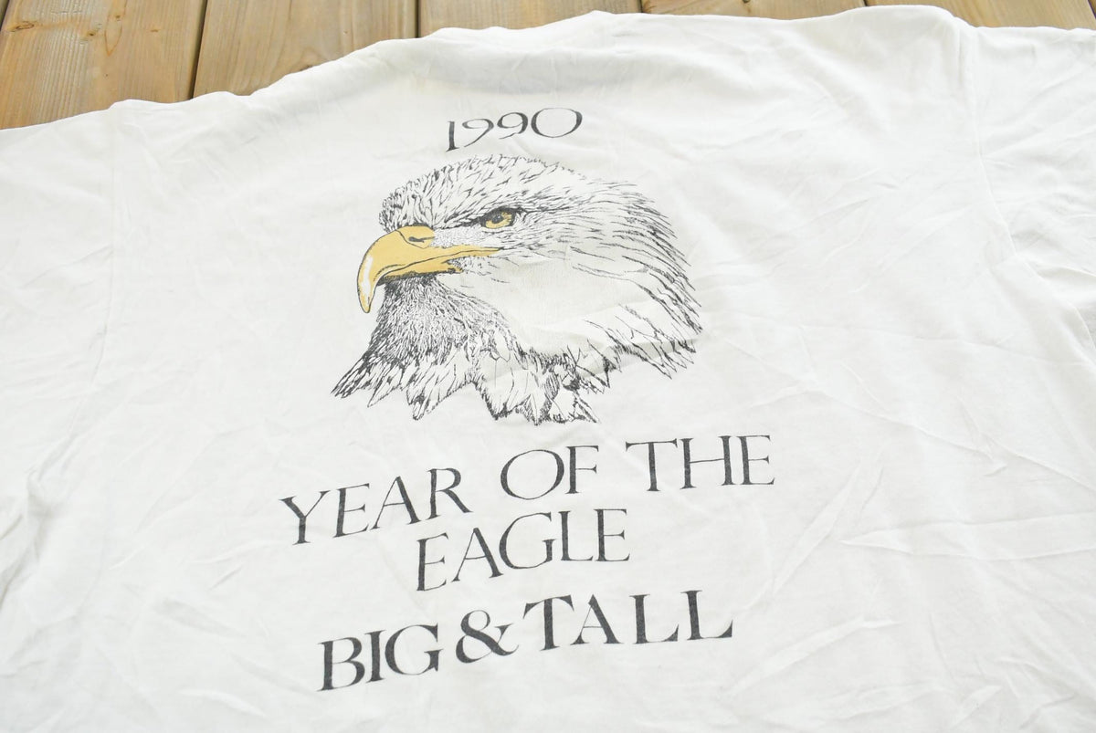 Vintage 1990s Small Town Bald Eagle Big Tall Souvenir T-Shirt Men's XL from propervintagecanada
