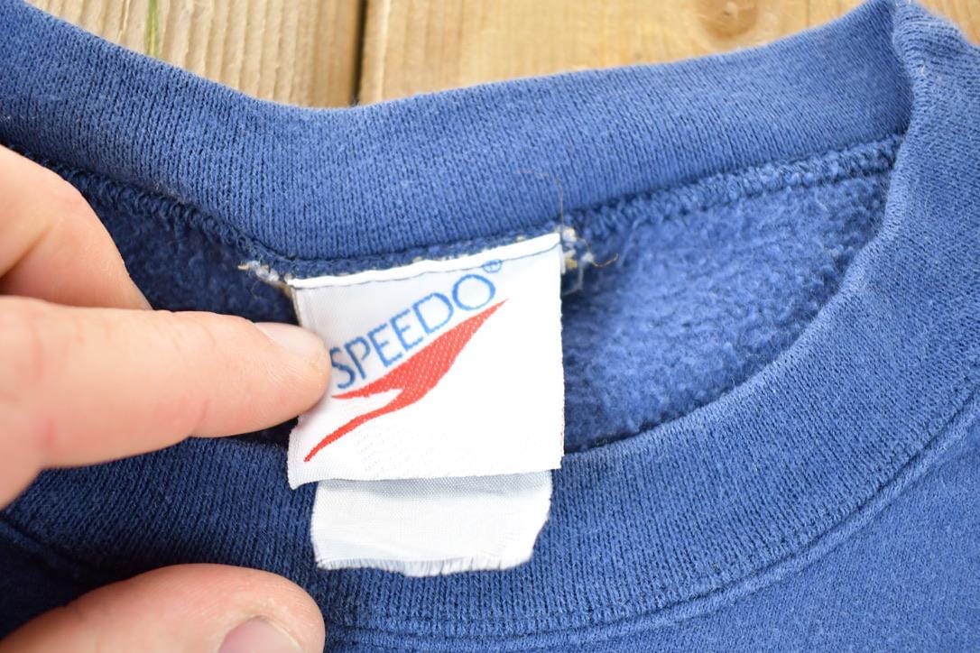 Vintage 1990s Speedo Rubber Patch Souvenir Crewneck Sweatshirt Made In USA Men's XL from propervintagecanada