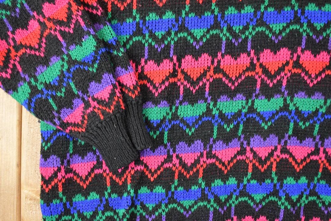 Vintage 1990s Stefano International AOP Rainbow Hearts Knit Crewneck Sweater Womens XL from propervintagecanada