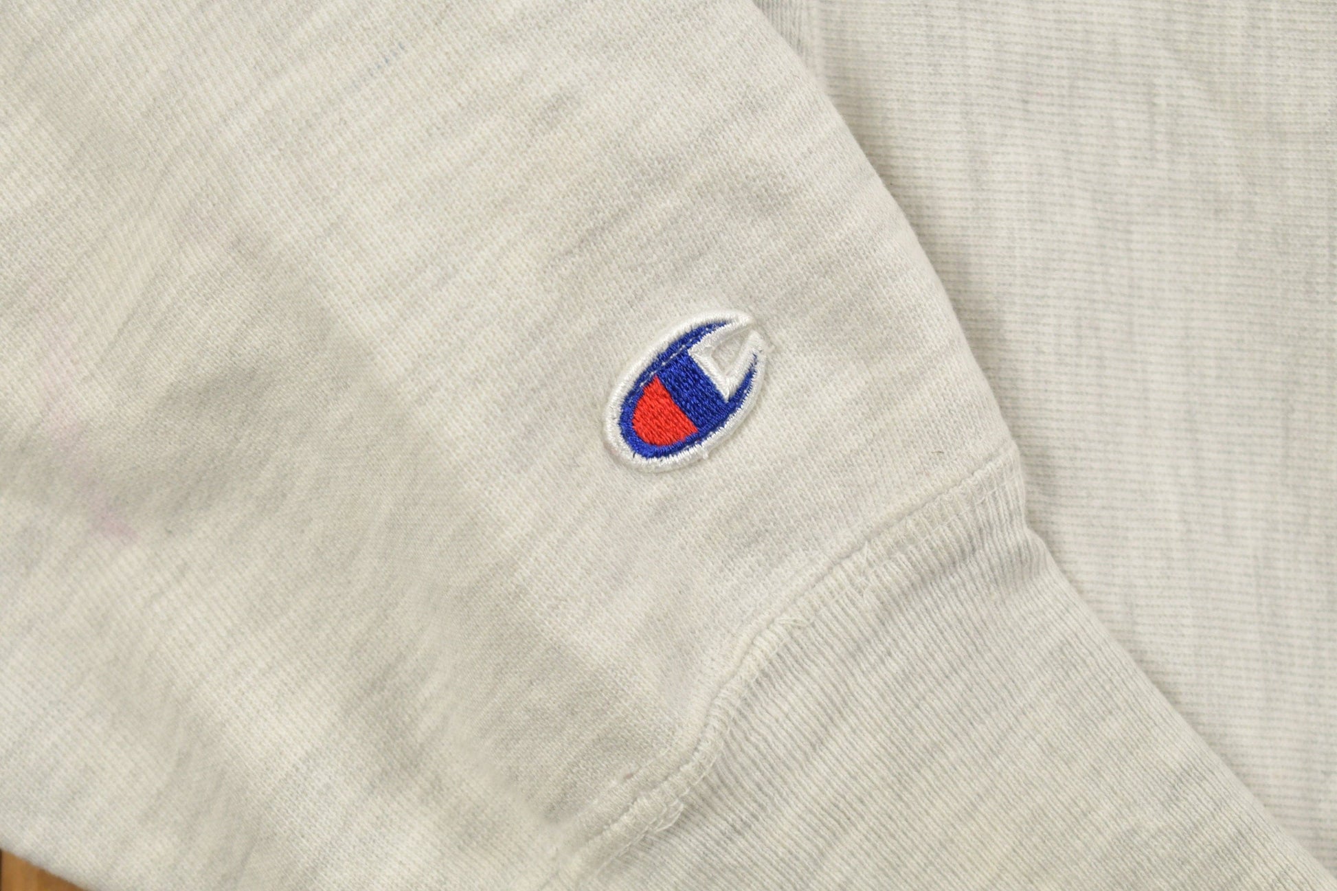 Vintage 1990s Stonehill University Collegiate Champion Reverse Weave Hoodie Men's Medium from propervintagecanada