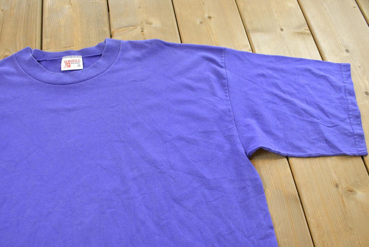 Vintage 1990s Sunbelt Purple Blank T-Shirt Men's M from propervintagecanada