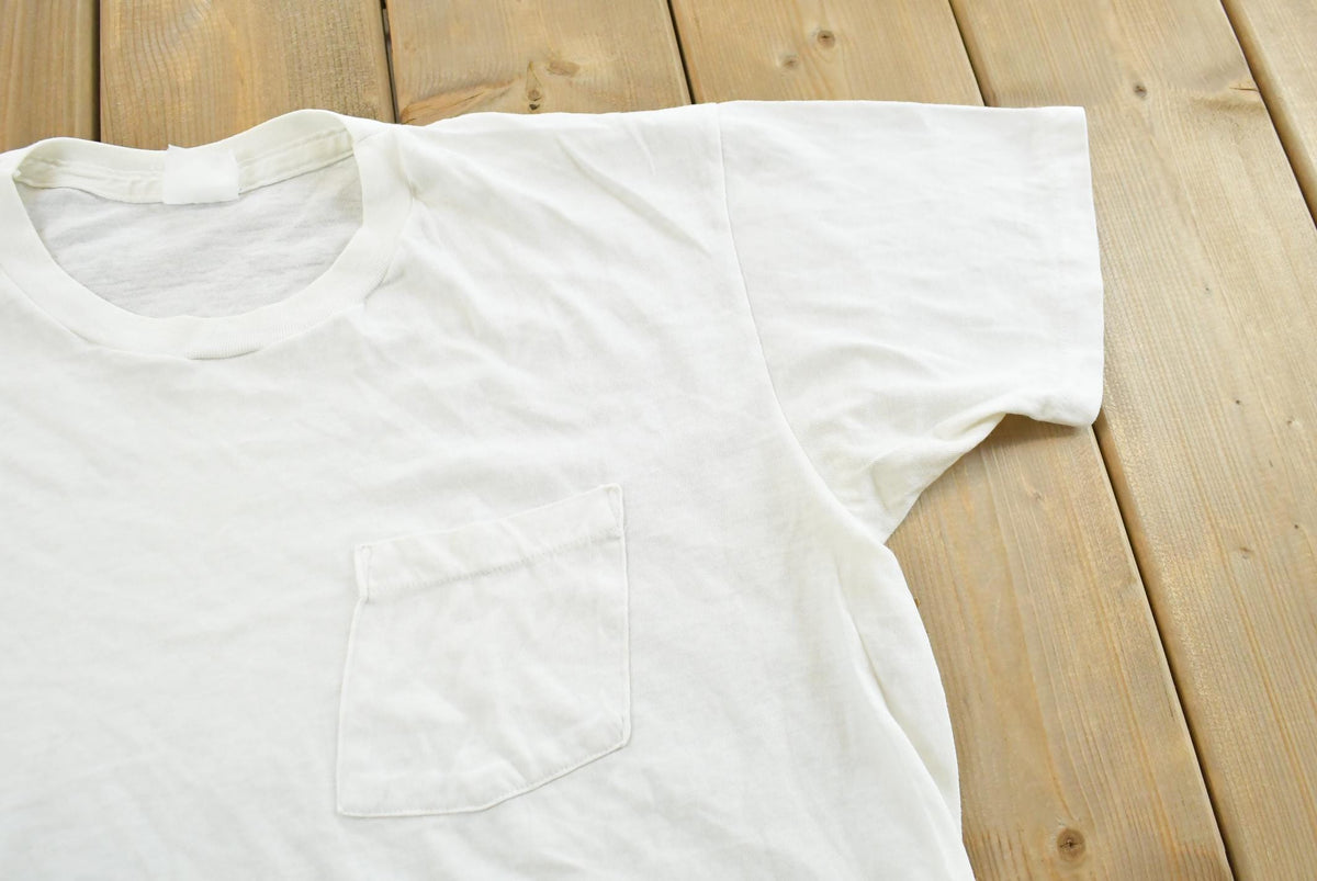 Vintage 1990s Super Faded Threadbare Blank White Pocket T-Shirt Mens L from propervintagecanada