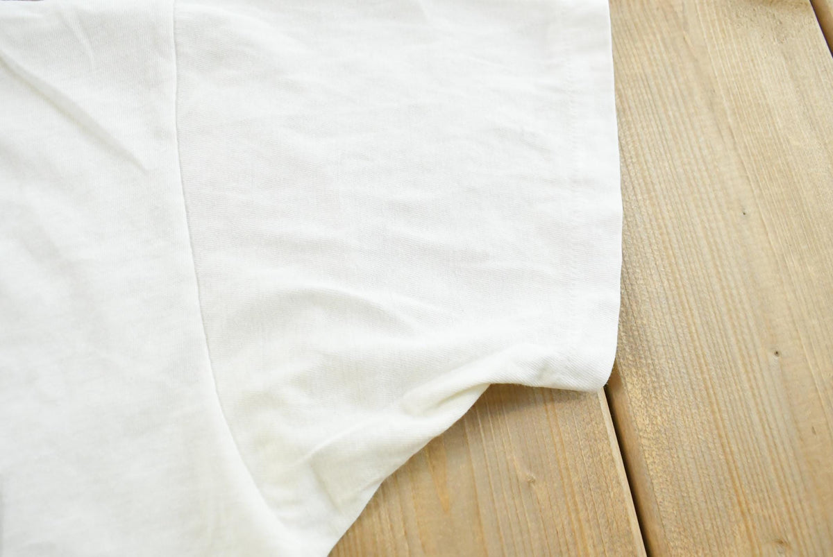 Vintage 1990s Super Faded Threadbare Blank White Pocket T-Shirt Mens L from propervintagecanada