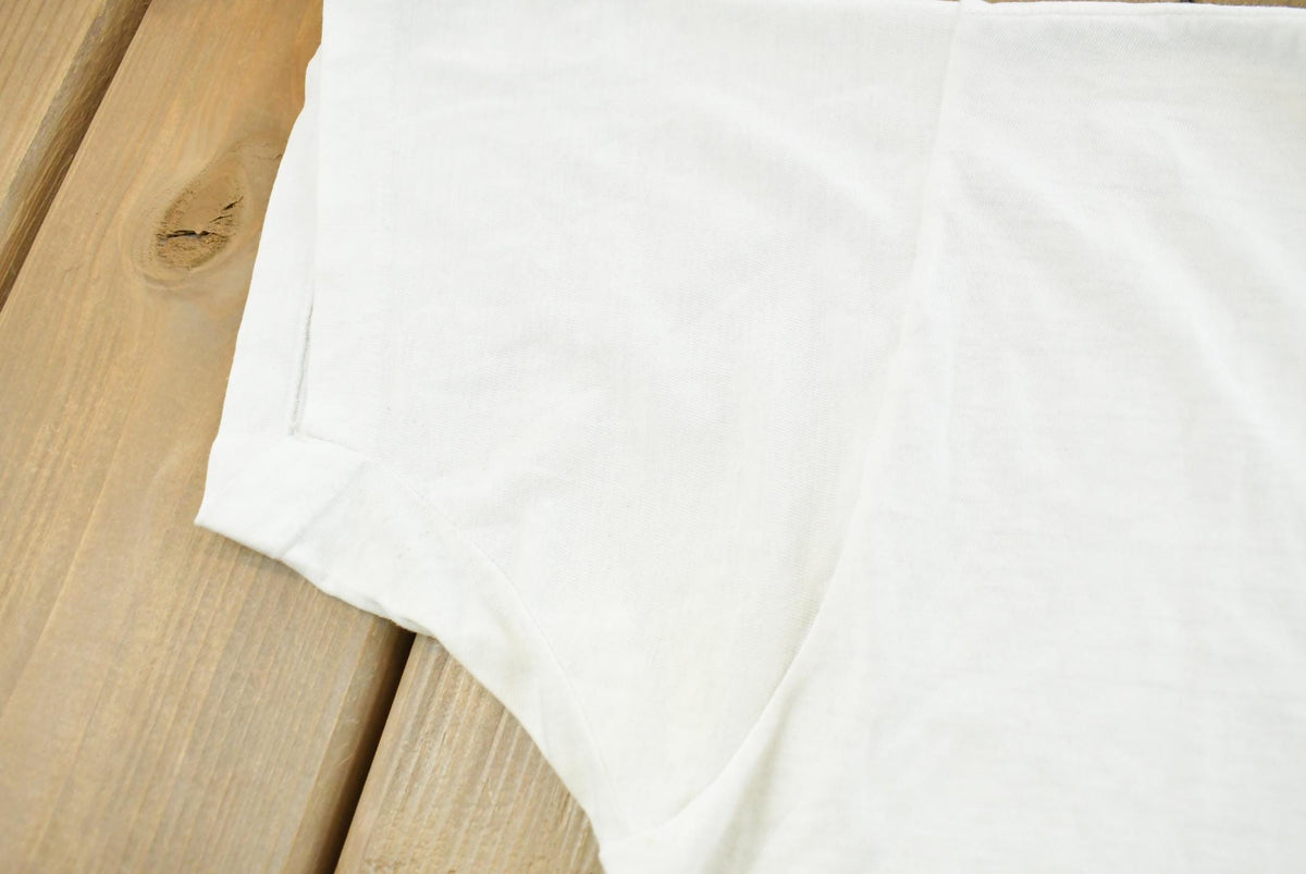 Vintage 1990s Super Faded Threadbare Blank White Pocket T-Shirt Mens L from propervintagecanada