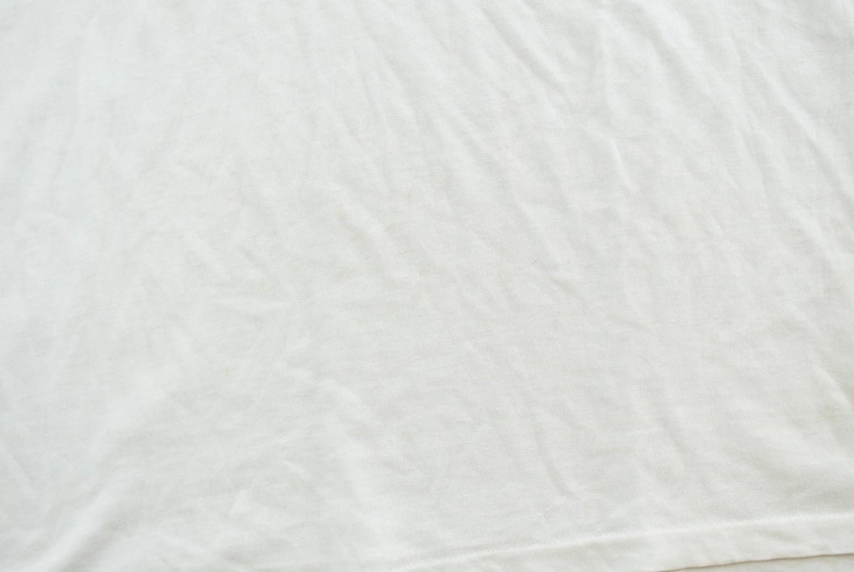 Vintage 1990s Super Faded Threadbare Blank White Pocket T-Shirt Mens L from propervintagecanada