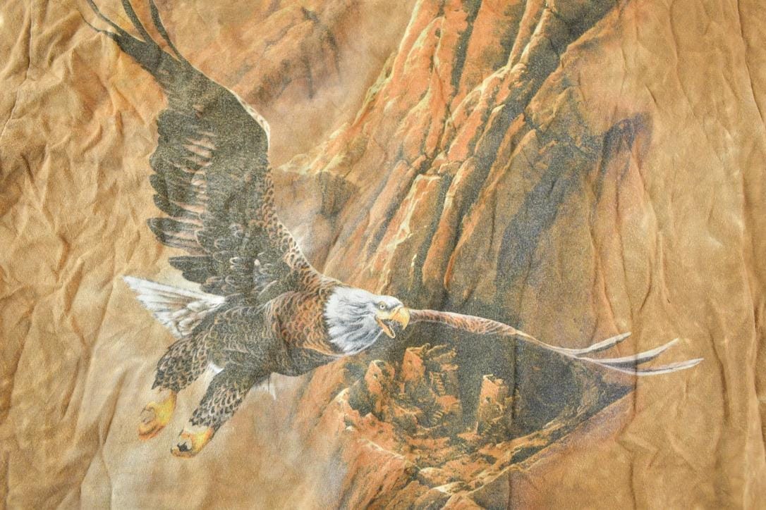 Vintage 1990s The Mountain American Eagle Souvenir Single Stitch Graphic Print T-Shirt Men's Large from propervintagecanada