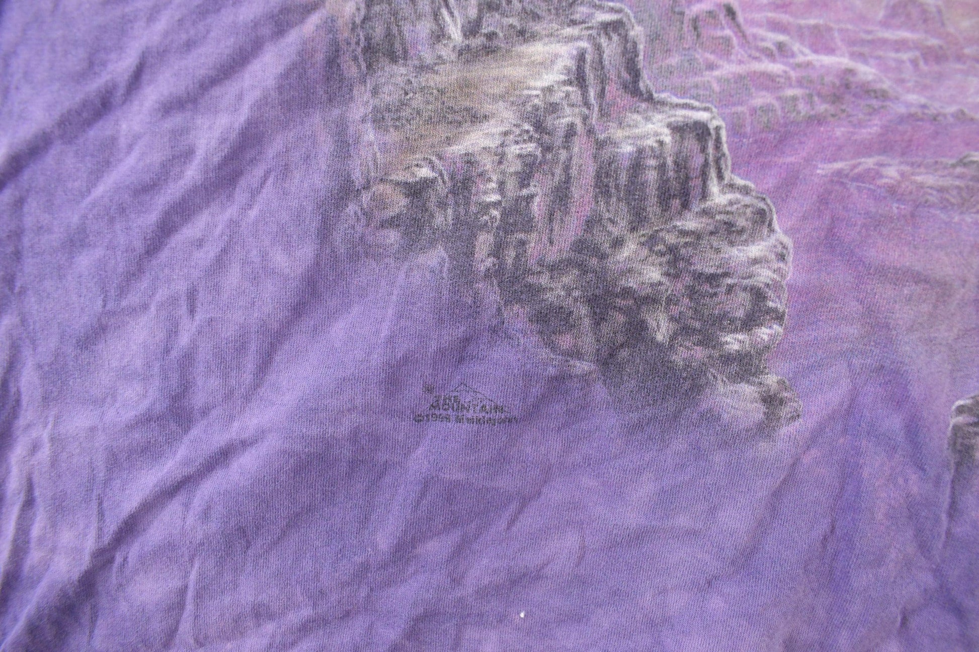 Vintage 1990s The Mountain Native Wolf Theme Tie Dye T-Shirt Men's 2XL from propervintagecanada