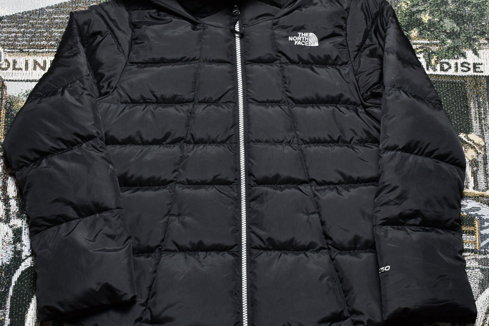 Vintage 1990s The North Face 550 Down Fill Puffer Jacket Youth Large from propervintagecanada