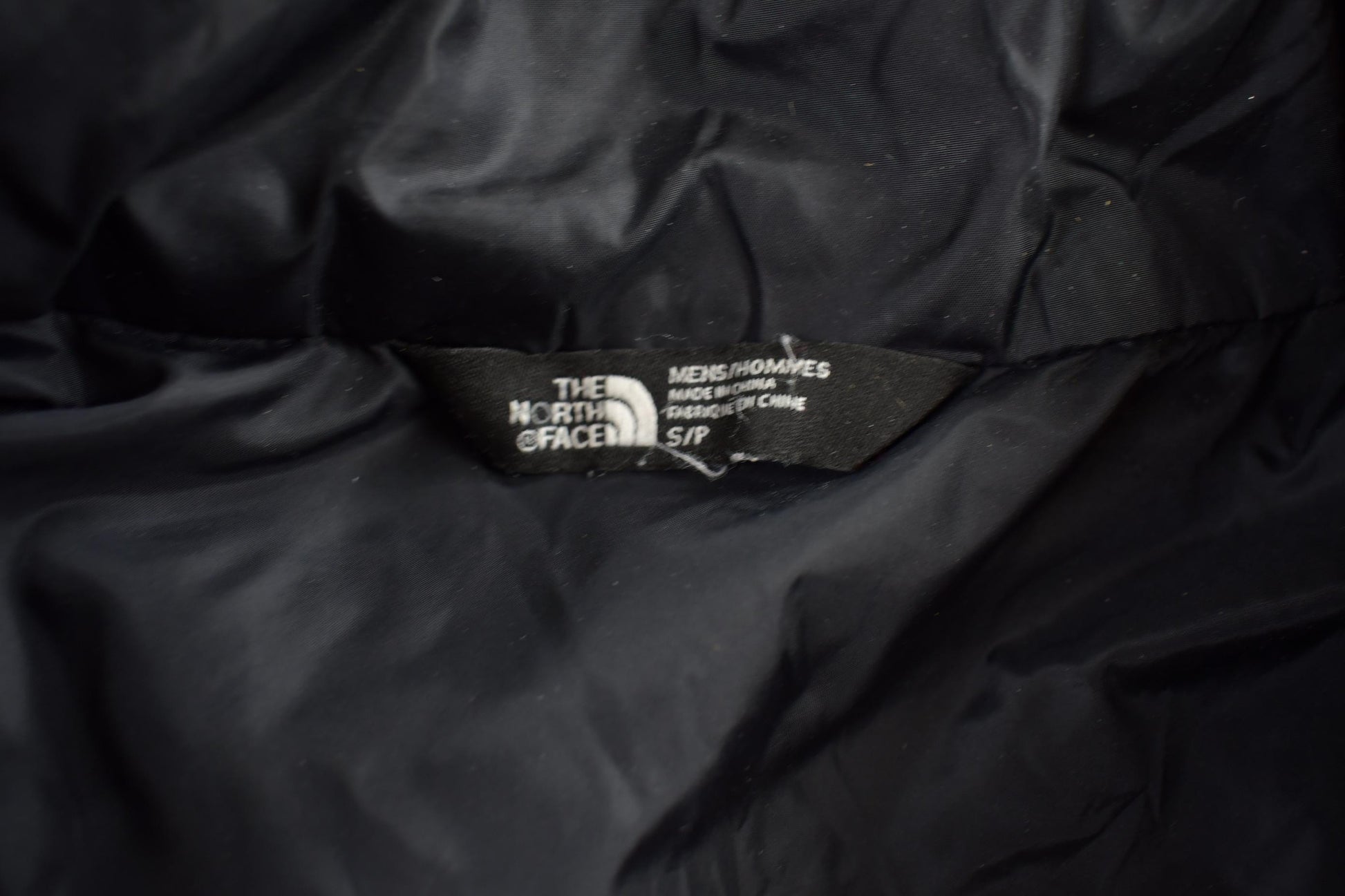 Vintage 1990s The North Face Small Black Puffer Jacket Men's S from propervintagecanada