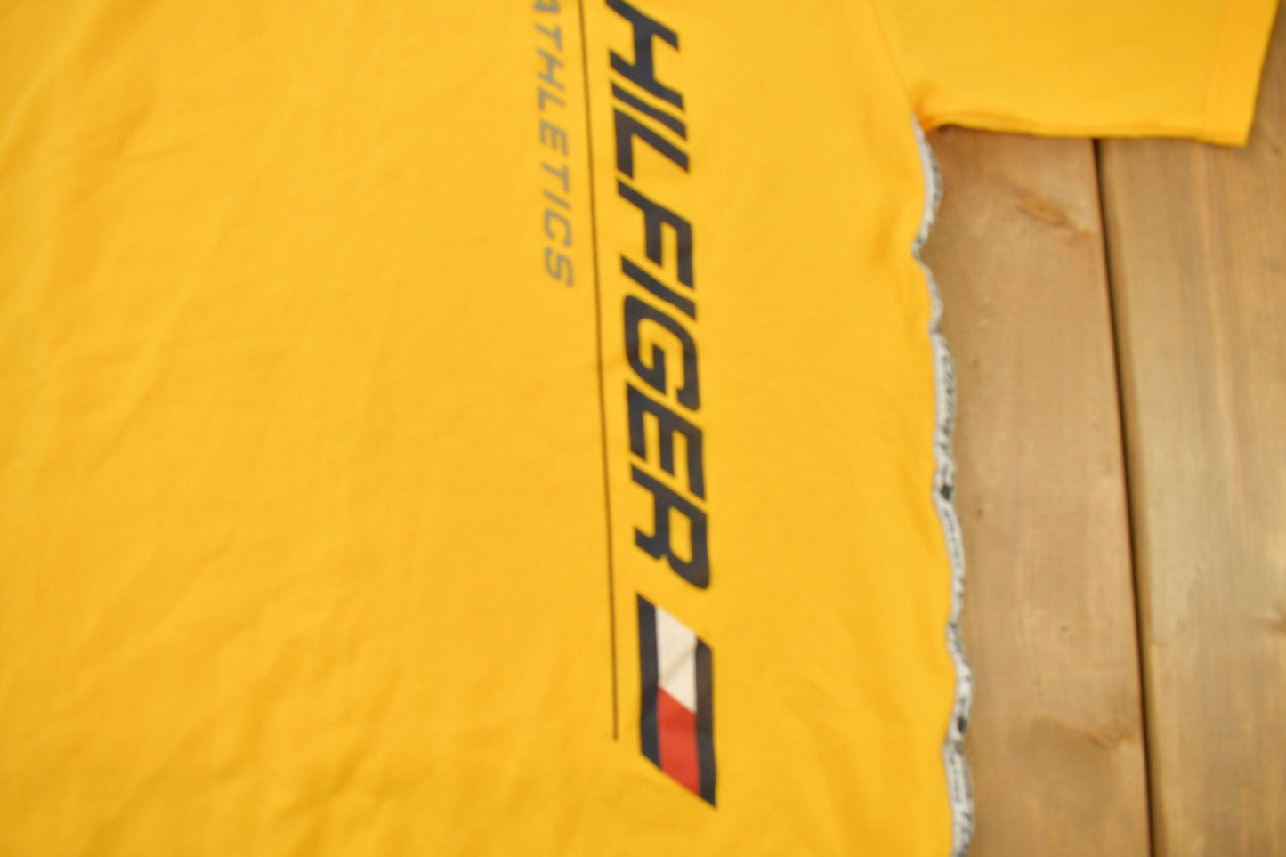 Vintage 1990s Tommy Hilfiger Athletics Graphic Jersey Style T Shirt Men's XL from propervintagecanada