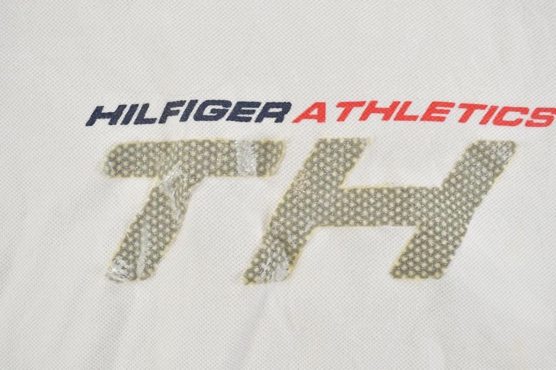 Vintage 1990s Tommy Hilfiger Athletics Graphic T-Shirt Men's XL from propervintagecanada