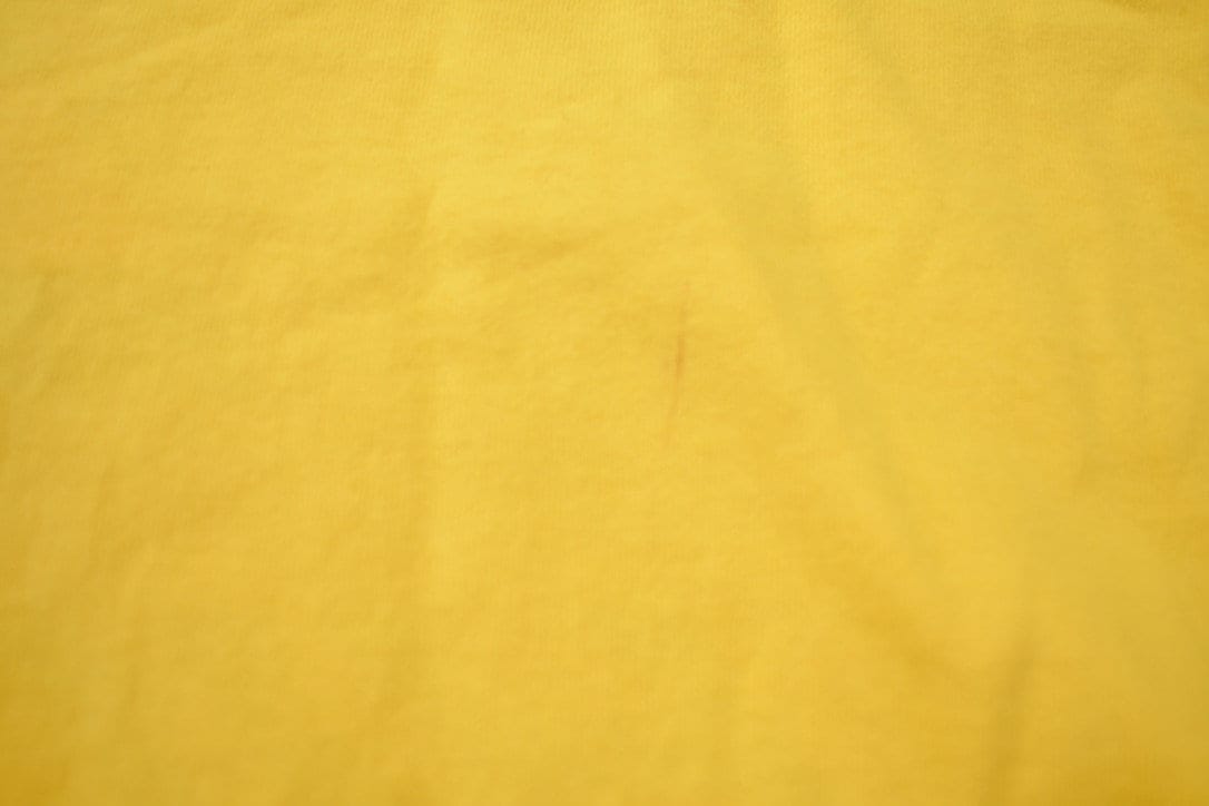 Vintage 1990s Tommy Hilfiger Athletics Logo Graphic T Shirt Men's XL from propervintagecanada