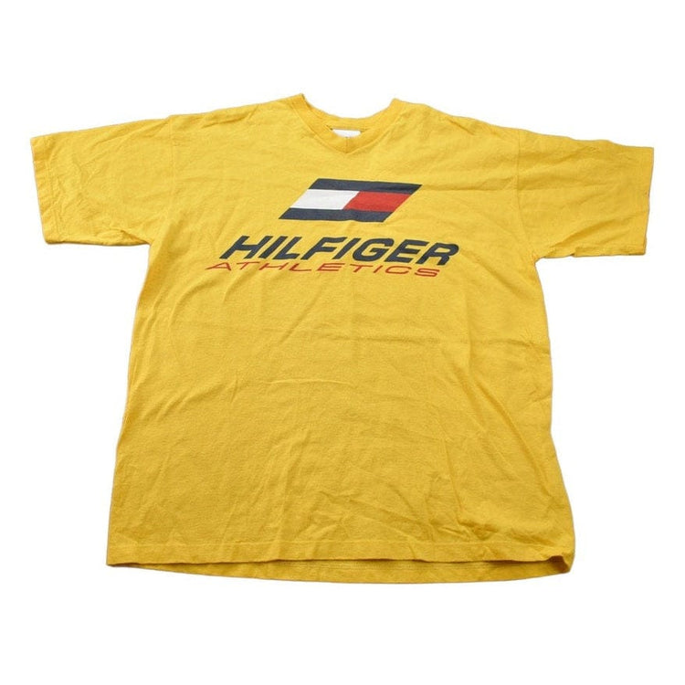 Vintage 1990s Tommy Hilfiger Athletics Logo Graphic T Shirt Men's XL from propervintagecanada