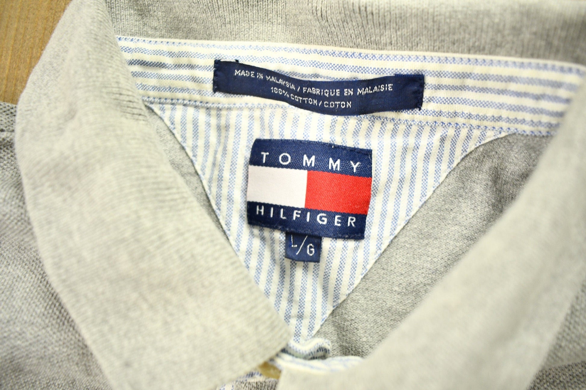 Vintage 1990s Tommy Hilfiger Crest Logo Polo Shirt Men's Large from propervintagecanada