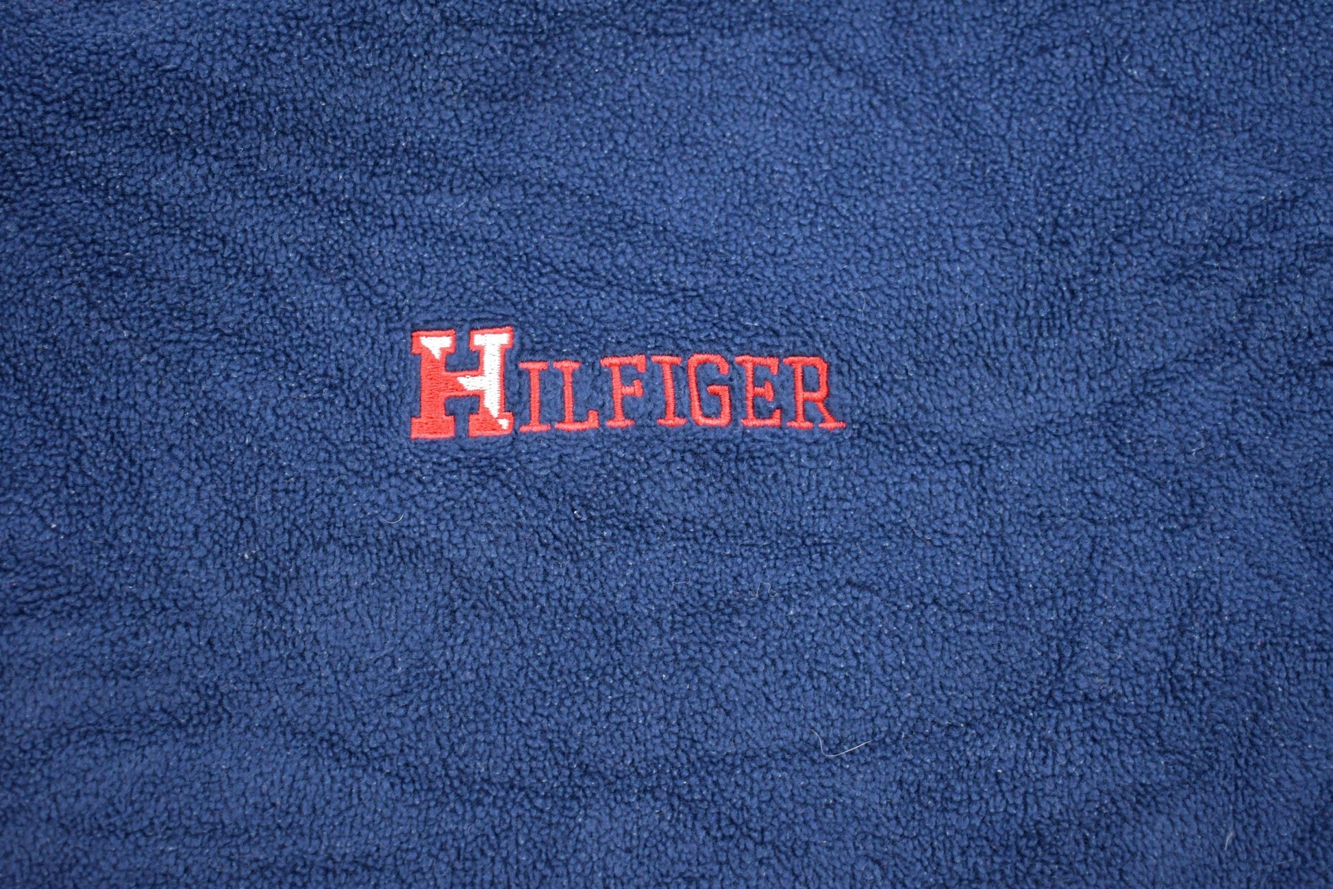 Vintage 1990s Tommy Hilfiger Embroidered Fleece Sweater Men's XL from propervintagecanada