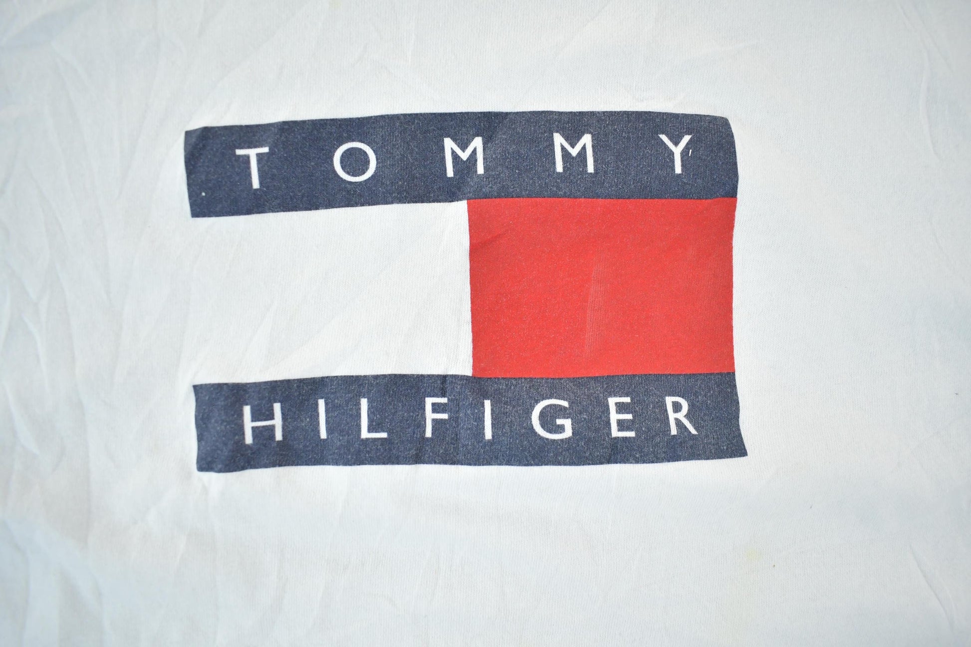Vintage 1990s Tommy Hilfiger Flag Graphic T-Shirt Men's XL from propervintagecanada