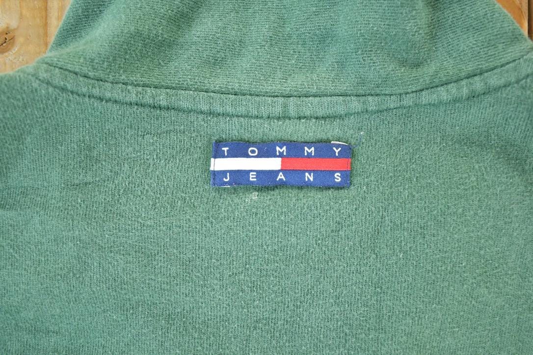 Vintage 1990s Tommy Jeans Souvenir Quarter Zip Crewneck Sweatshirt Made In USA Men's Large from propervintagecanada