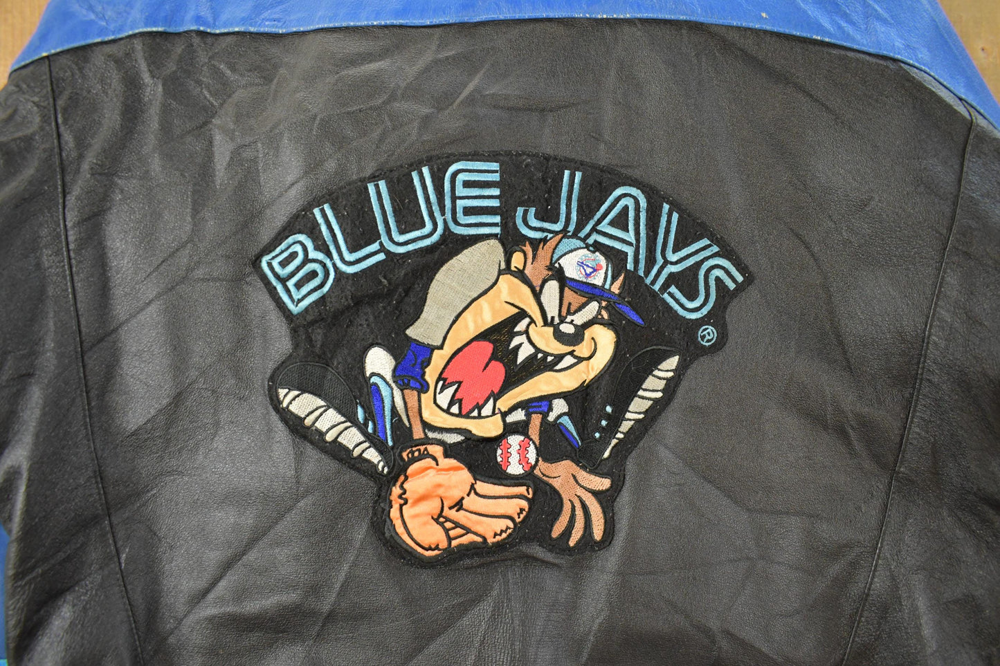 Vintage 1990s Toronto Blue Jays Looney Tunes Leather Jacket Men's Large from propervintagecanada