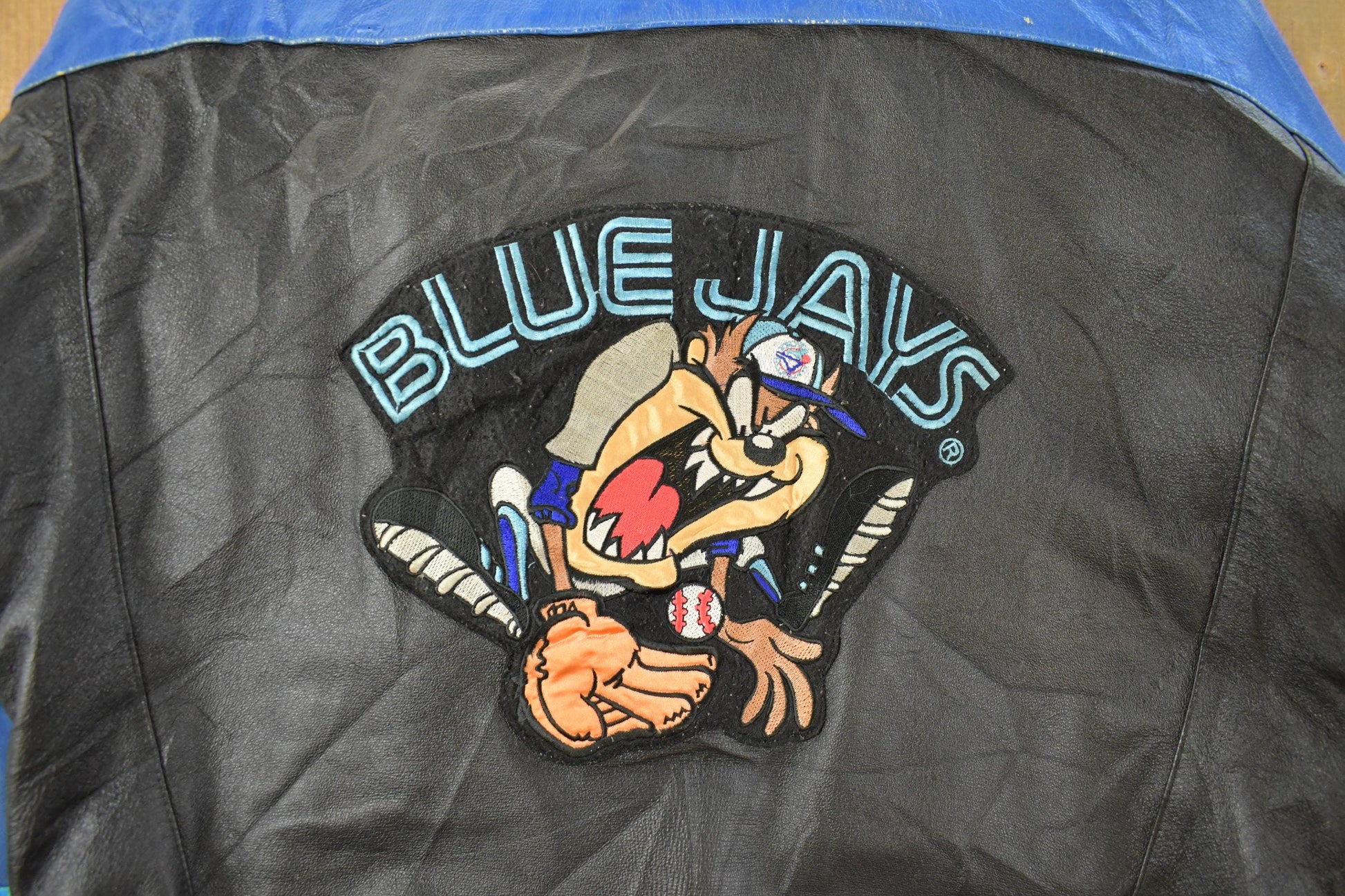 Vintage 1990s Toronto Blue Jays Looney Tunes Leather Jacket Men's Large from propervintagecanada