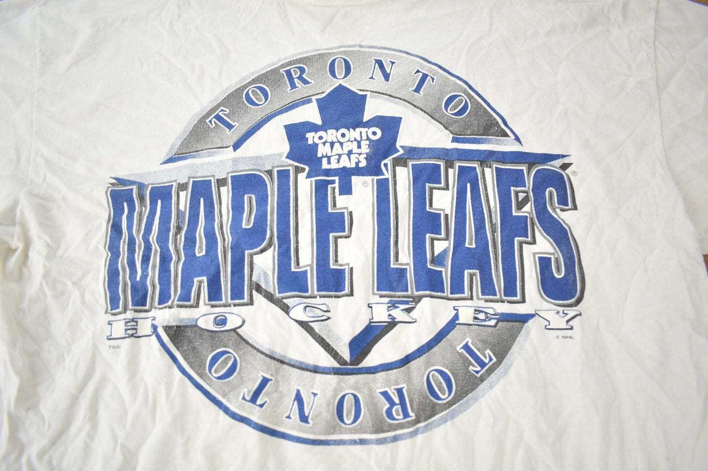 Vintage 1990s Toronto Maple Leafs NHL Hockey Graphic T-Shirt Made In USA from propervintagecanada