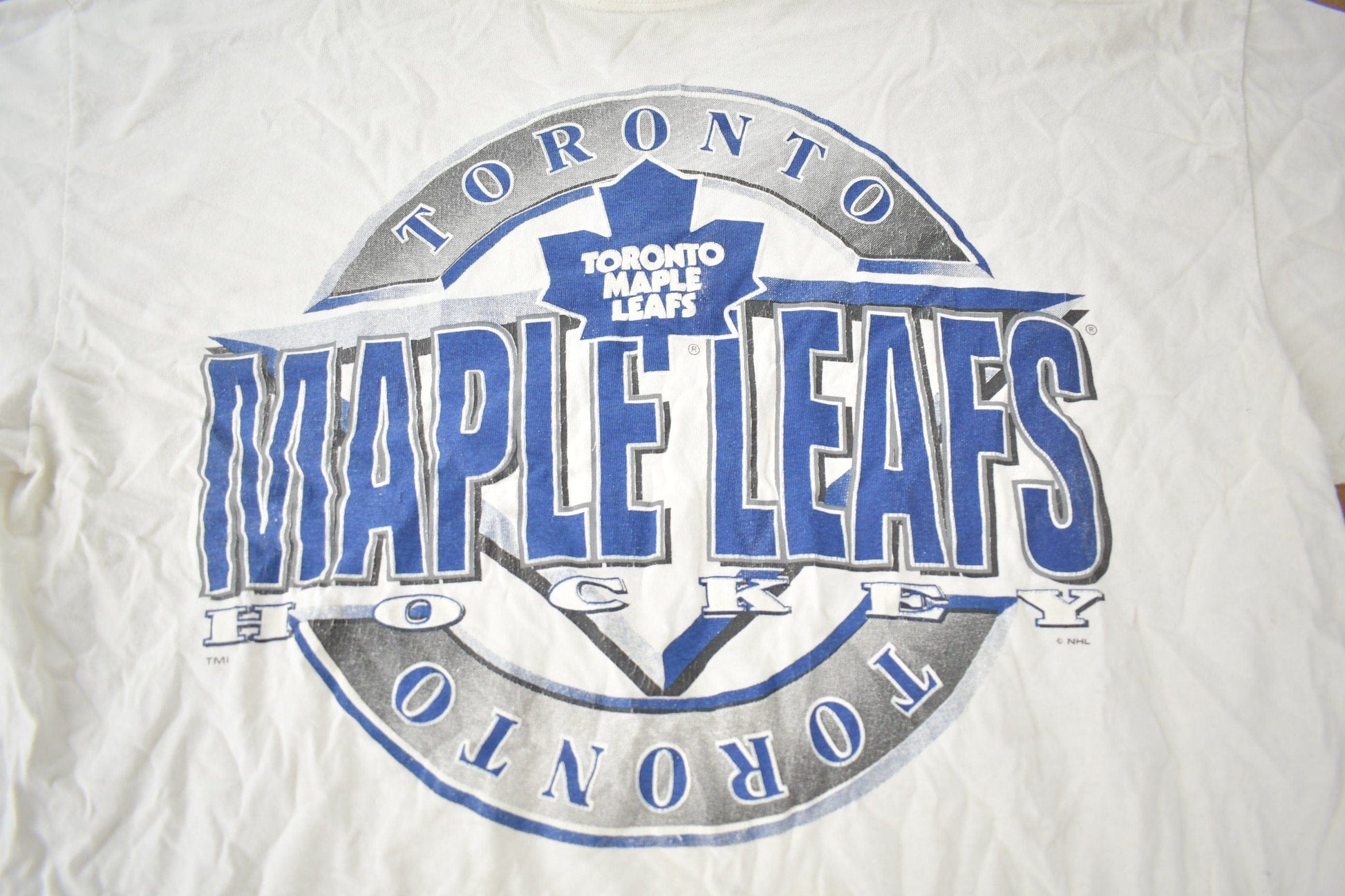 Vintage 1990s Toronto Maple Leafs NHL Hockey Graphic T-Shirt Made In USA from propervintagecanada