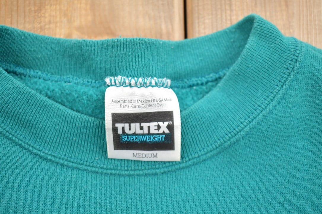 Vintage 1990s Tultex Blank Turquoise Crewneck Sweatshirt Men's Small from propervintagecanada
