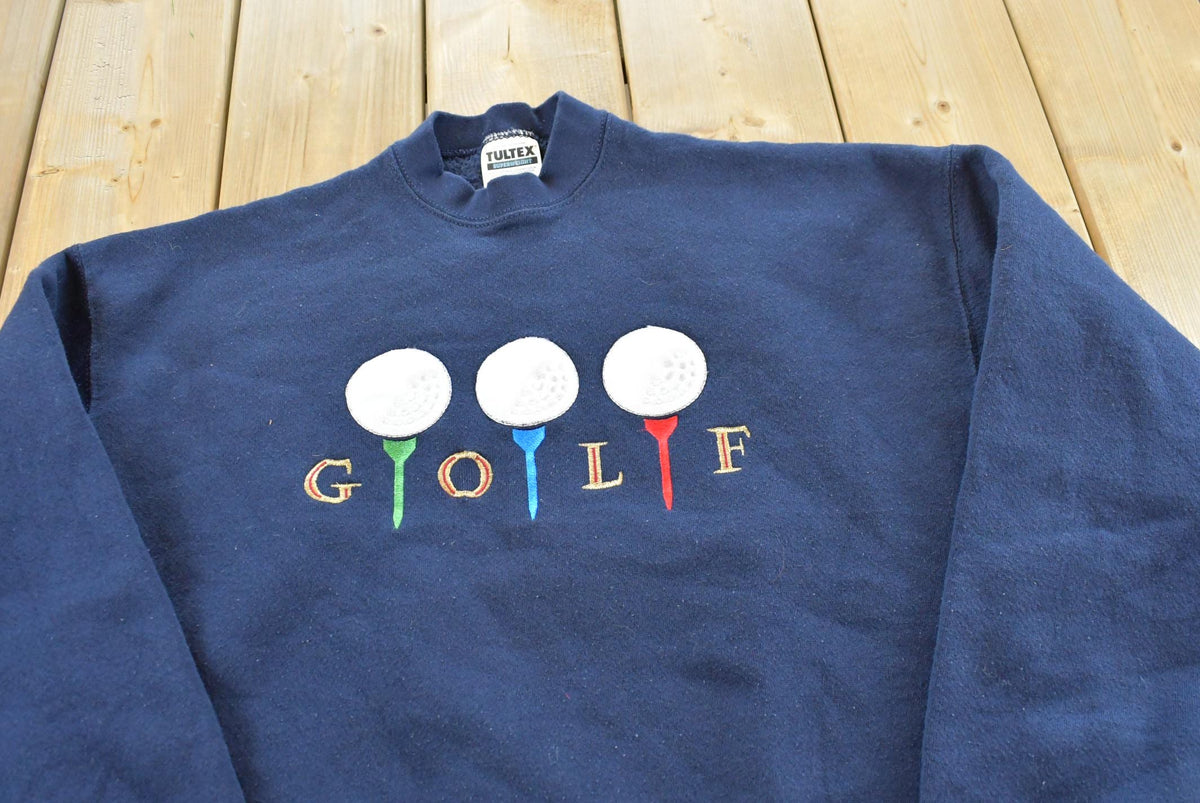 Vintage 1990s Tultex Navy Blue Embroidered Golf Crewneck Sweatshirt Men's L from propervintagecanada