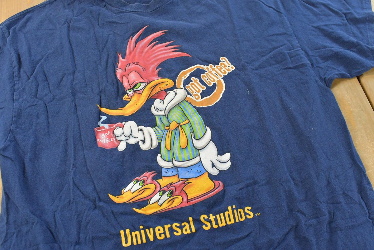 Vintage 1990s Universal Studios Woody Woodpecker Got Coffee Souvenir Cartoon T-Shirt Men's XL from propervintagecanada