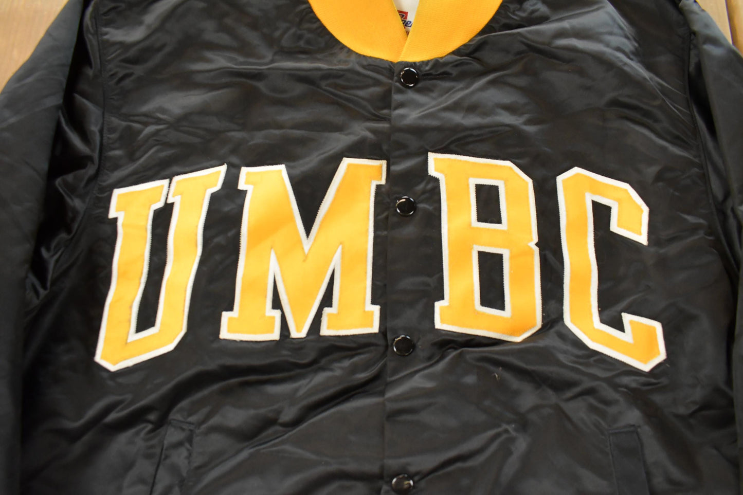 Vintage 1990s University of Maryland Baltimore County Collegiate Satin Snap On Jacket Men's XL from propervintagecanada